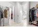 Walk-in closet with ample storage space leads to Primary bath at 8111 Sw 95Th Ct, Ocala, FL 34481