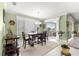 Cozy dining area with a view of the backyard through sliding glass doors, filled with natural light at 8111 Sw 95Th Ct, Ocala, FL 34481