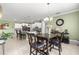 Inviting dining area connected to the kitchen, featuring a chandelier and offering ample natural light at 8111 Sw 95Th Ct, Ocala, FL 34481