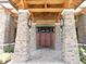Stunning stone columns frame the entrance to the clubhouse with stone and wood beam design at 8111 Sw 95Th Ct, Ocala, FL 34481