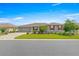 Charming single-story home with a well-manicured lawn, red shutters, and a brick-paved driveway at 8111 Sw 95Th Ct, Ocala, FL 34481