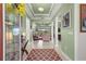 Elegant foyer with tray ceilings, tile flooring, and a view into the living room at 8111 Sw 95Th Ct, Ocala, FL 34481