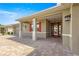 Inviting front porch with brick-paved flooring, decorative columns, and a charming front door at 8111 Sw 95Th Ct, Ocala, FL 34481