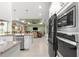 Bright kitchen with granite countertops opens to a living area at 8111 Sw 95Th Ct, Ocala, FL 34481