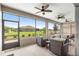 Inviting screened porch with ceiling fans, comfortable seating and expansive views of the landscaped backyard at 8111 Sw 95Th Ct, Ocala, FL 34481