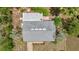 Aerial view of a home with a gray roof, showcasing its well-maintained exterior at 8449 Sw 105Th Pl, Ocala, FL 34481
