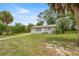 Charming single-story home featuring a one car garage and a well-maintained front yard with mature trees at 8449 Sw 105Th Pl, Ocala, FL 34481