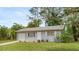 Inviting single-story home with attached garage, complemented by a well-kept lawn at 8449 Sw 105Th Pl, Ocala, FL 34481