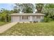 Charming single-story home with a well-manicured front yard and an attached garage at 8449 Sw 105Th Pl, Ocala, FL 34481