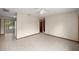 Spacious living room showcasing tile floors, neutral walls, and multiple doorways for an open and airy feel at 8449 Sw 105Th Pl, Ocala, FL 34481
