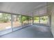 Enclosed screened patio with calming views of the outdoors at 8449 Sw 105Th Pl, Ocala, FL 34481