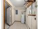 Utility room featuring a water heater and shelving at 8449 Sw 105Th Pl, Ocala, FL 34481