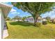 Charming home with a sprawling green lawn and mature trees, ideal for outdoor enjoyment at 8722 Sw 60Th Cir, Ocala, FL 34476
