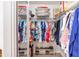 Walk-in closet with ample storage and well-organized clothing racks and shelves at 8722 Sw 60Th Cir, Ocala, FL 34476
