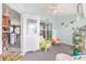 Relaxing Florida room offers access to the kitchen and outdoor space for seamless indoor-outdoor living at 8722 Sw 60Th Cir, Ocala, FL 34476