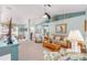 Open living room featuring neutral carpeting, and a ceiling fan at 8722 Sw 60Th Cir, Ocala, FL 34476