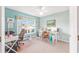 Bright office with light-blue walls, carpet flooring, and a large window for natural light at 8722 Sw 60Th Cir, Ocala, FL 34476