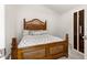 Cozy bedroom featuring a wooden bed frame, and neutral color palette at 907 Trifu Ter, The Villages, FL 32163