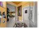Inviting foyer with stone archway leading to living area, unique decor, and neutral color palette at 907 Trifu Ter, The Villages, FL 32163