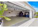 Spacious three-car garage with epoxy flooring and golf carts, offering ample parking and storage at 907 Trifu Ter, The Villages, FL 32163