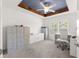 This home office features a sleek ceiling fan, accent beams, and a bright work space with file storage at 907 Trifu Ter, The Villages, FL 32163