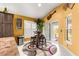 Eat-in kitchen area with breakfast table, seating for four, and sliding glass door to patio at 907 Trifu Ter, The Villages, FL 32163