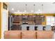 Kitchen featuring stainless steel appliances and granite countertops, viewed from the living room at 907 Trifu Ter, The Villages, FL 32163