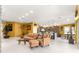 Open-concept living room flowing into the island kitchen, perfect for entertaining and casual living at 907 Trifu Ter, The Villages, FL 32163