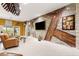 Spacious living room with unique accent wall, sliding glass doors and comfortable seating at 907 Trifu Ter, The Villages, FL 32163