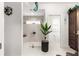 This bright white walk-in shower boasts decor, a window and a seat, adjoined to the primary bathroom with double sinks at 907 Trifu Ter, The Villages, FL 32163
