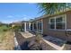 A view of the backyard with patio, lawn, palm tree, and a screened in porch at 9649 Sw 90Th St, Ocala, FL 34481