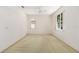 Bright bedroom features neutral carpet, two windows, and a ceiling fan at 9649 Sw 90Th St, Ocala, FL 34481