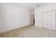 A bedroom features a ceiling fan, plush carpeting, and a closet for storage at 9649 Sw 90Th St, Ocala, FL 34481
