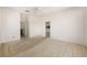 Neutral bedroom with a ceiling fan, carpeted floors, and access to bathroom and kitchen at 9649 Sw 90Th St, Ocala, FL 34481