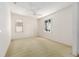 This spacious bedroom features a ceiling fan and two windows for natural light at 9649 Sw 90Th St, Ocala, FL 34481