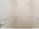 A walk-in closet features white wire shelving for optimal storage and organization space at 9649 Sw 90Th St, Ocala, FL 34481