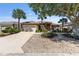 Exterior of a well-kept home with beautiful landscaping, a spacious driveway, and a two-car garage at 9649 Sw 90Th St, Ocala, FL 34481