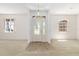 Bright foyer with tiled entrance, decorative glass door, and access to the living areas at 9649 Sw 90Th St, Ocala, FL 34481