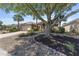 Charming single-story home featuring a well-manicured lawn, lovely landscaping, and a circular driveway at 9649 Sw 90Th St, Ocala, FL 34481