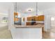 Kitchen featuring wood cabinets, stainless steel appliances, breakfast bar and hanging lights at 9649 Sw 90Th St, Ocala, FL 34481