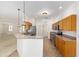 Well-lit kitchen featuring stainless steel appliances, wooden cabinets, and a functional breakfast bar at 9649 Sw 90Th St, Ocala, FL 34481