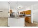 Bright kitchen with stainless appliances, wood cabinets, and breakfast bar that overlooks the living area at 9649 Sw 90Th St, Ocala, FL 34481