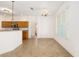 Open kitchen design featuring oak cabinets, a breakfast bar, and a sunny window at 9649 Sw 90Th St, Ocala, FL 34481