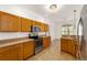 Kitchen featuring ample cabinet space, stainless steel appliances, and an open view of the breakfast nook at 9649 Sw 90Th St, Ocala, FL 34481