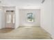 This bright living room features a stylish front door and large window at 9649 Sw 90Th St, Ocala, FL 34481