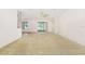 Spacious living area features a ceiling fan and sliding door to outside at 9649 Sw 90Th St, Ocala, FL 34481