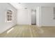 Well-lit living room features a curved window and access to other rooms at 9649 Sw 90Th St, Ocala, FL 34481