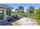 Outdoor patio with tiled flooring and views of the green backyard and golf course at 9649 Sw 90Th St, Ocala, FL 34481
