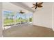 Spacious sunroom with large windows offering panoramic views of the golf course at 9649 Sw 90Th St, Ocala, FL 34481