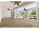 Sunroom with large windows offering panoramic views of the outdoors at 9649 Sw 90Th St, Ocala, FL 34481
